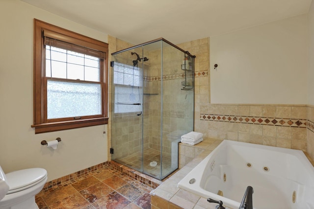 249 Blenheim Rd, Columbus, OH 43214 - full bathroom with a shower stall, a jetted tub, and toilet