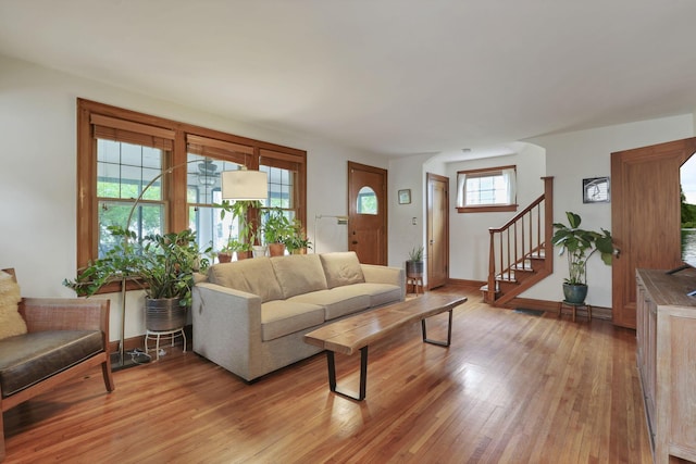 249 Blenheim Rd, Columbus, OH 43214 - living room featuring light wood finished floors, stairs, and baseboards