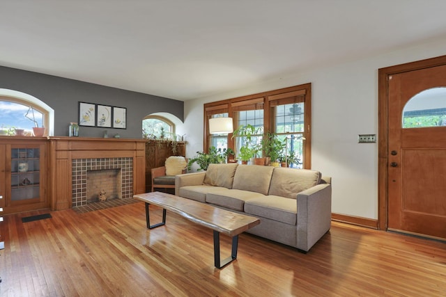 249 Blenheim Rd, Columbus, OH 43214 - living room with light wood-style floors and a fireplace