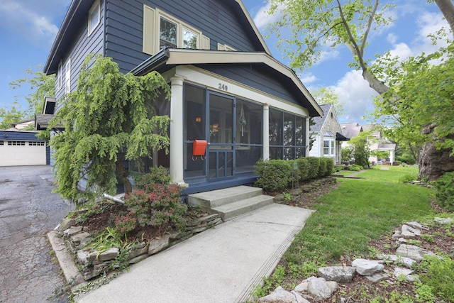 249 Blenheim Rd, Columbus, OH 43214 - view of side of property featuring a sunroom and a lawn