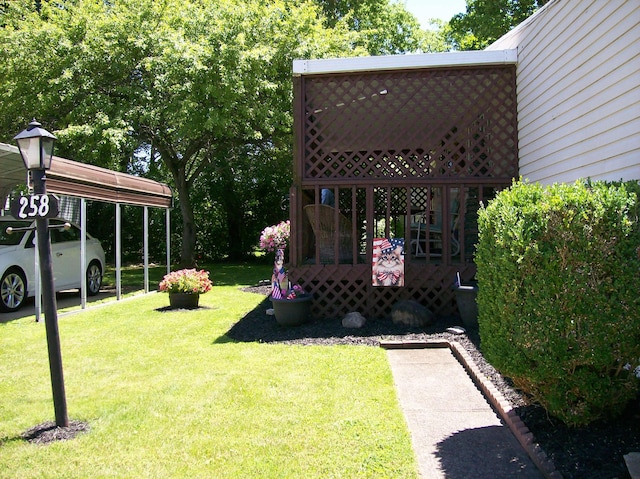 258 Timberline Dr, Circleville, OH 43113 - view of grassy yard with a detached carport