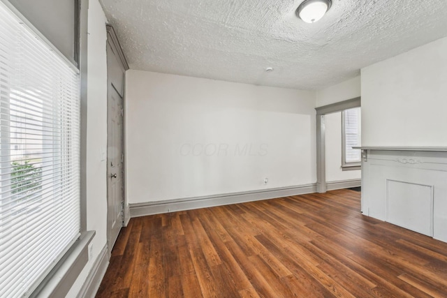 112 S Cypress Ave, Columbus, OH 43222 - unfurnished room with wood finished floors and a textured ceiling