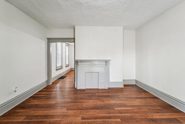 112 S Cypress Ave, Columbus, OH 43222 - spare room with wood finished floors, a textured ceiling, and baseboards