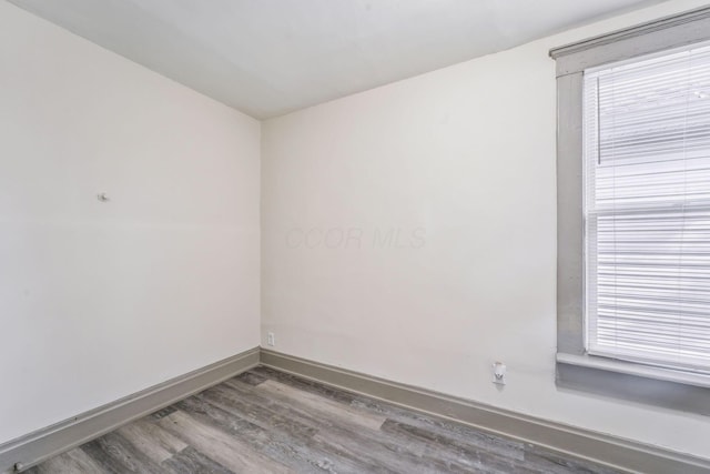 112 S Cypress Ave, Columbus, OH 43222 - empty room with wood finished floors, baseboards, and plenty of natural light