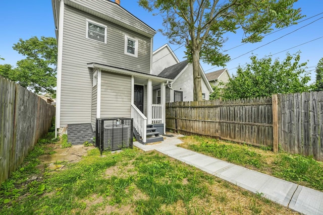 112 S Cypress Ave, Columbus, OH 43222 - rear view of property featuring entry steps, a fenced backyard, and cooling unit