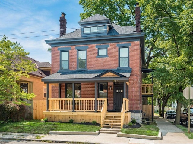 1217 Franklin Ave, Columbus, OH 43205 - traditional style home featuring a chimney, a porch, brick siding, and roof with shingles