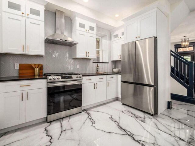 1217 Franklin Ave, Columbus, OH 43205 - kitchen featuring stainless steel appliances, wall chimney range hood, light marble finish flooring, backsplash, and recessed lighting