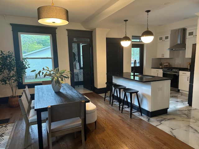 1217 Franklin Ave, Columbus, OH 43205 - dining room featuring healthy amount of natural light, baseboards, and light wood finished floors