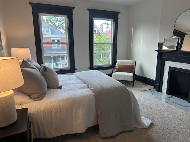 1217 Franklin Ave, Columbus, OH 43205 - bedroom featuring a fireplace and baseboards