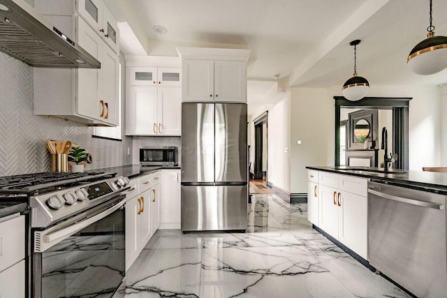 1217 Franklin Ave, Columbus, OH 43205 - kitchen with appliances with stainless steel finishes, under cabinet range hood, light marble finish floors, a sink, and tasteful backsplash