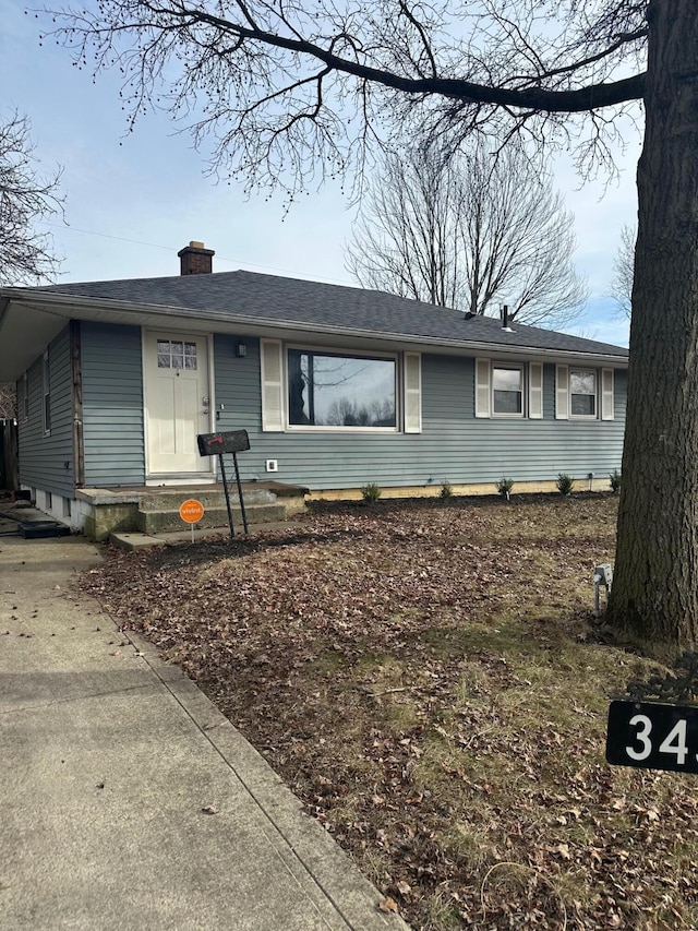 3434 Kenlawn St, Columbus, OH 43224 - ranch-style house featuring a chimney