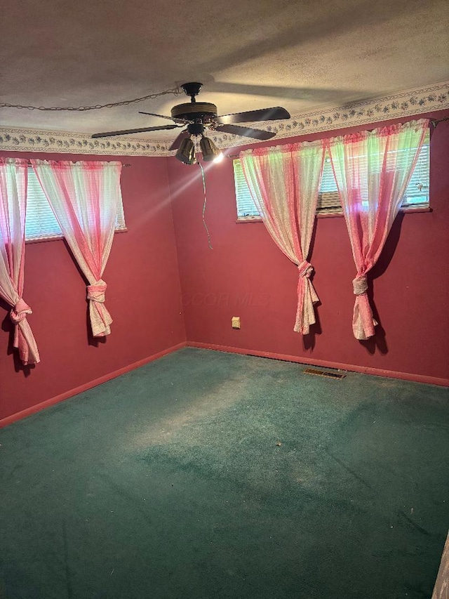 909 Stephen Dr W, Columbus, OH 43204 - empty room featuring carpet floors, ceiling fan, a textured ceiling, and baseboards