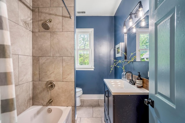 976 Oakwood Ave, Columbus, OH 43206 - full bath with vanity, toilet, tile patterned floors, bathing tub / shower combination, and baseboards