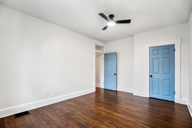 976 Oakwood Ave, Columbus, OH 43206 - unfurnished bedroom featuring dark wood-style floors, baseboards, and a ceiling fan