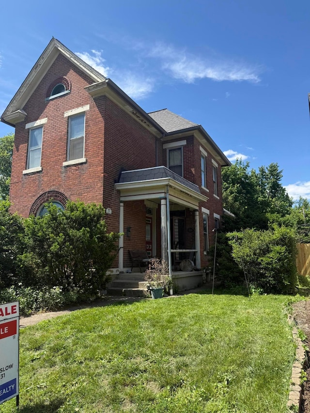 158 E Morrill Ave, Columbus, OH 43207 - view of front of home with brick siding and a front lawn