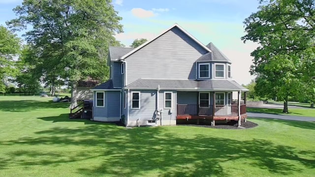 350 S Houston Pike, South Vienna, OH 45369 - back of house with a lawn, covered porch, and a shingled roof