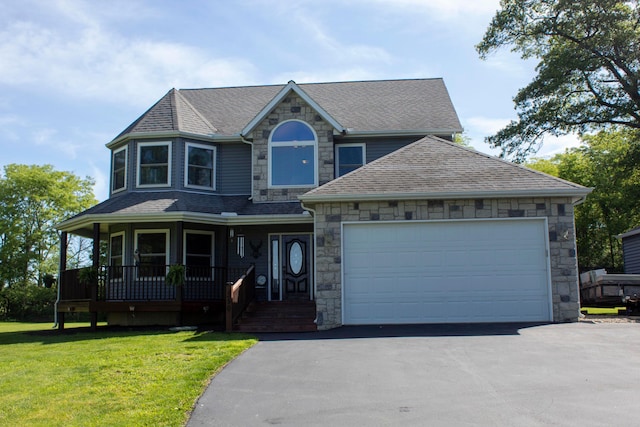 350 S Houston Pike, South Vienna, OH 45369 - view of front facade featuring a shingled roof, driveway, stone siding, and covered porch