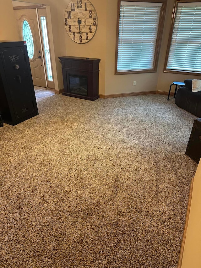 350 S Houston Pike, South Vienna, OH 45369 - unfurnished living room with carpet flooring, baseboards, and a glass covered fireplace