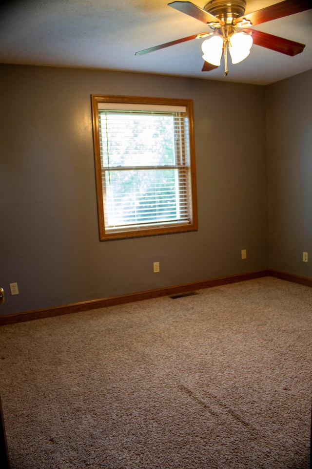 350 S Houston Pike, South Vienna, OH 45369 - unfurnished room with carpet floors, a ceiling fan, and baseboards