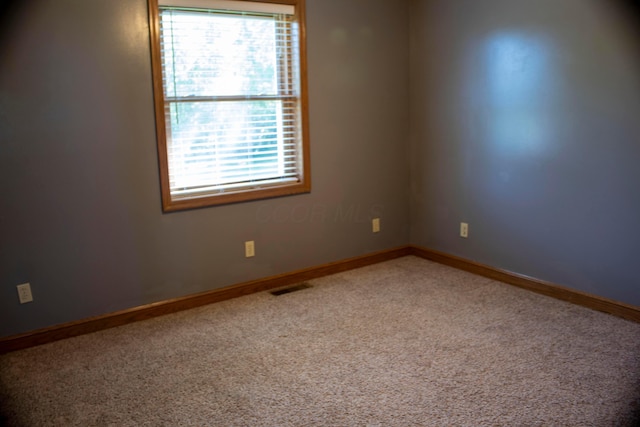 350 S Houston Pike, South Vienna, OH 45369 - spare room featuring healthy amount of natural light, carpet, and baseboards
