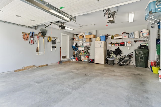 48 E 4th Ave, Columbus, OH 43201 - garage featuring freestanding refrigerator and a garage door opener