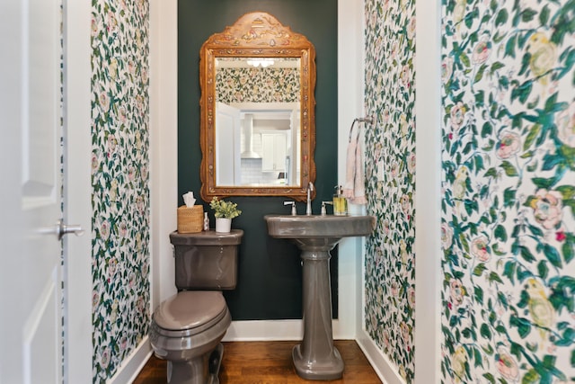 48 E 4th Ave, Columbus, OH 43201 - bathroom featuring baseboards, toilet, and wood finished floors
