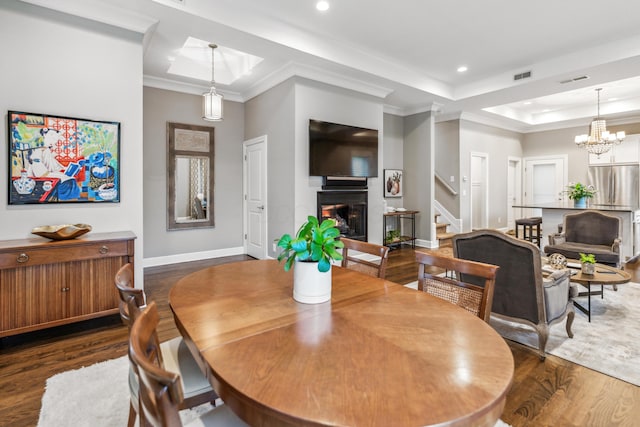 48 E 4th Ave, Columbus, OH 43201 - dining space with a glass covered fireplace, baseboards, stairs, wood finished floors, and recessed lighting