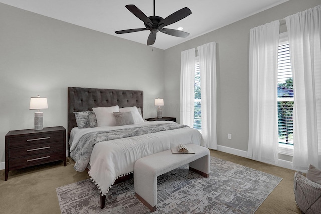 48 E 4th Ave, Columbus, OH 43201 - carpeted bedroom featuring multiple windows, baseboards, and ceiling fan
