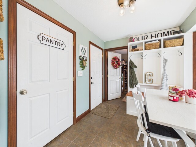 6297 Stage Coach Rd NW, Rushville, OH 43150 - mudroom with dark tile patterned flooring