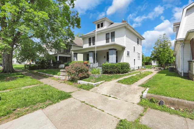 683 E 2nd St, Chillicothe, OH 45601 - traditional style home featuring covered porch, a front lawn, and central AC