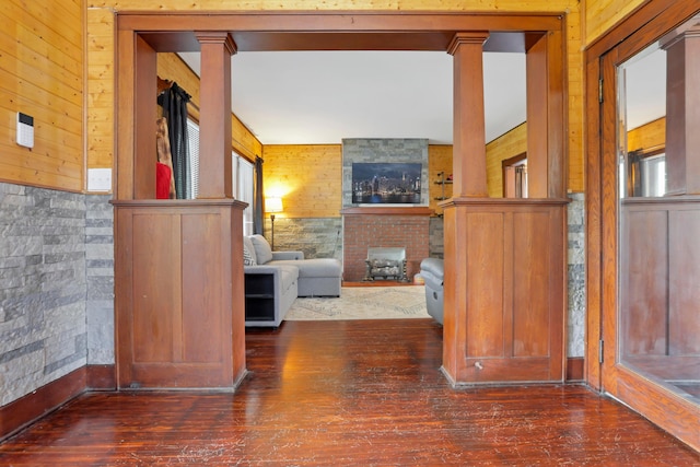 683 E 2nd St, Chillicothe, OH 45601 - hallway featuring wood finished floors, decorative columns, and wooden walls