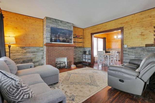 683 E 2nd St, Chillicothe, OH 45601 - living area with wooden walls, a large fireplace, and wood finished floors
