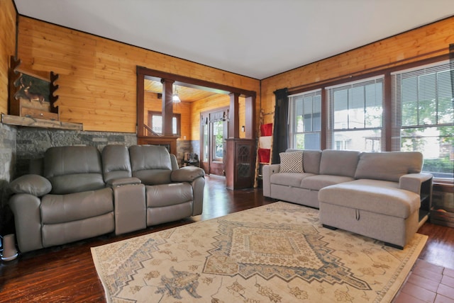 683 E 2nd St, Chillicothe, OH 45601 - living area featuring wood walls, plenty of natural light, and dark wood-style floors