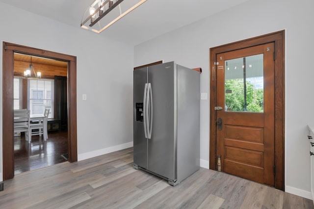 683 E 2nd St, Chillicothe, OH 45601 - kitchen with stainless steel refrigerator with ice dispenser, light wood-style floors, plenty of natural light, and baseboards
