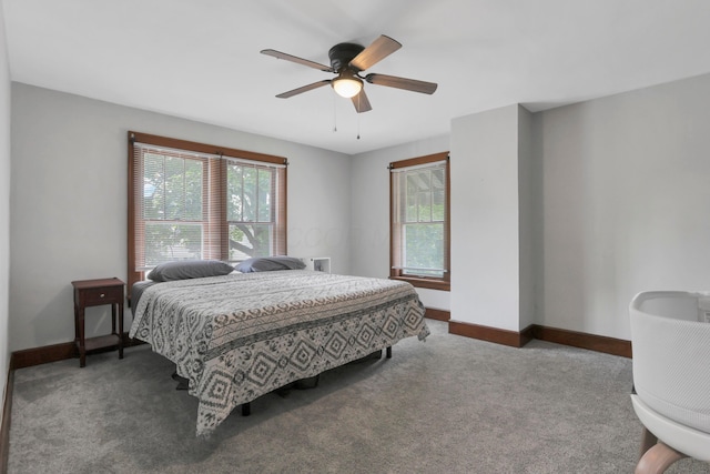 683 E 2nd St, Chillicothe, OH 45601 - carpeted bedroom featuring multiple windows, baseboards, and a ceiling fan