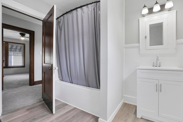 683 E 2nd St, Chillicothe, OH 45601 - full bath featuring vanity, shower / bath combination with curtain, wood finished floors, and baseboards