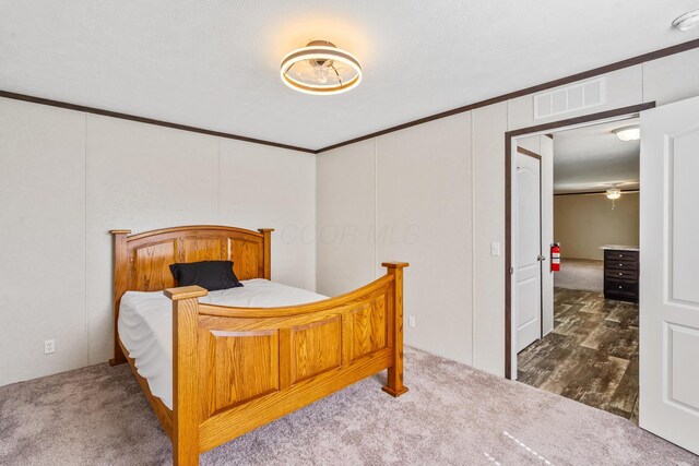 50 Winter Pine Dr, Delaware, OH 43015 - bedroom featuring ornamental molding and dark carpet