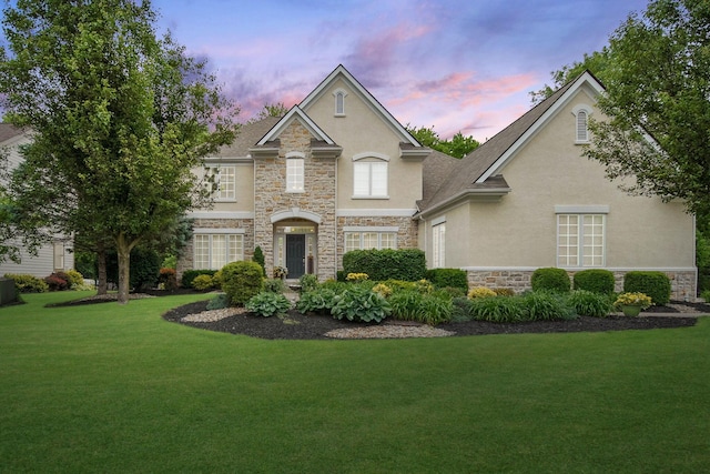 2941 Seaway Ct, Lewis Center, OH 43035 - traditional-style home featuring stucco siding, stone siding, a yard, and a garage