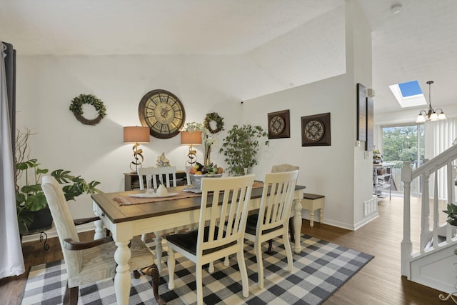 7400 Olympic Club Ct, Pickerington, OH 43147 - dining space with wood finished floors, vaulted ceiling, a skylight, and baseboards
