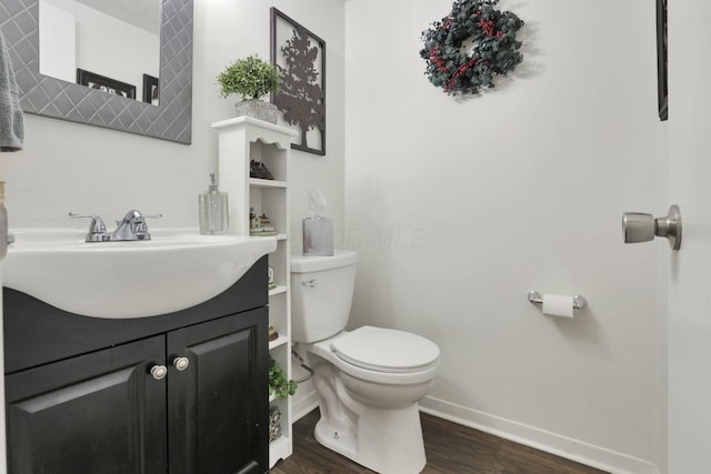 7400 Olympic Club Ct, Pickerington, OH 43147 - half bathroom featuring wood finished floors, baseboards, toilet, and vanity