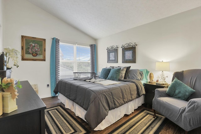 7400 Olympic Club Ct, Pickerington, OH 43147 - bedroom with vaulted ceiling, dark wood-style floors, baseboards, and a textured ceiling