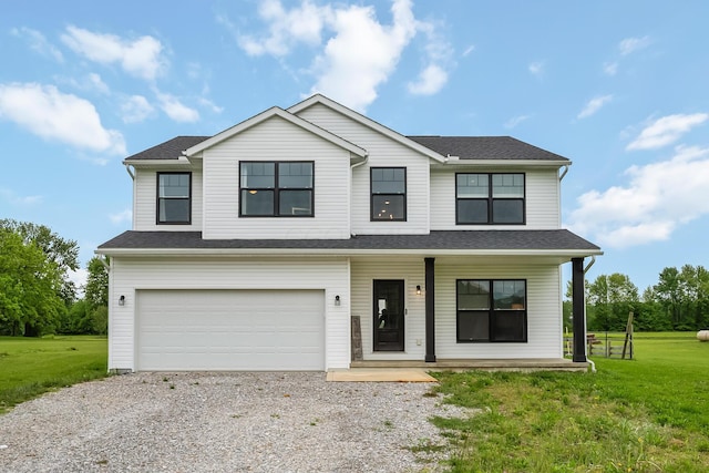 4483 County Road 124, Cardington, OH 43315 - view of front of house featuring a porch, driveway, an attached garage, and a front yard