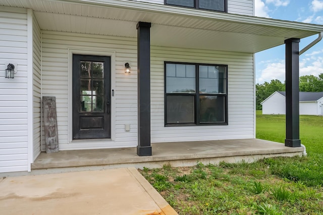 4483 County Road 124, Cardington, OH 43315 - view of exterior entry featuring covered porch and a lawn