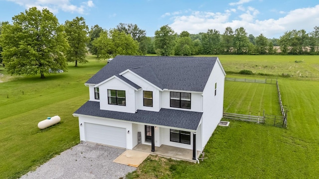 4483 County Road 124, Cardington, OH 43315 - view of front of home with driveway, roof with shingles, an attached garage, a porch, and view of wooded area