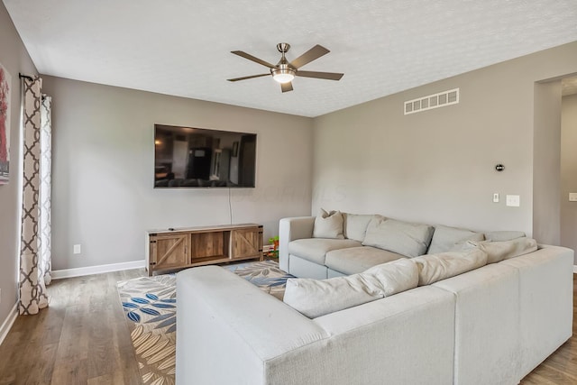 4483 County Road 124, Cardington, OH 43315 - living area featuring a ceiling fan, wood finished floors, and baseboards
