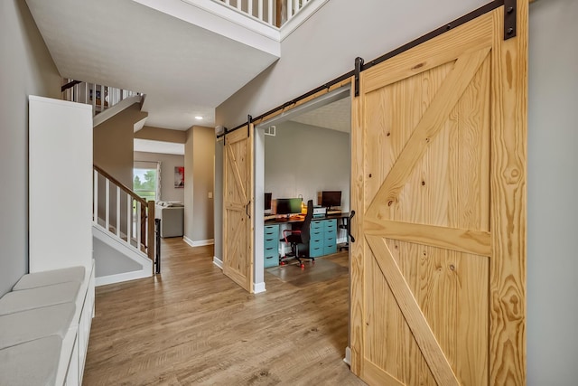 4483 County Road 124, Cardington, OH 43315 - foyer entrance with a barn door, stairs, wood finished floors, baseboards, and recessed lighting