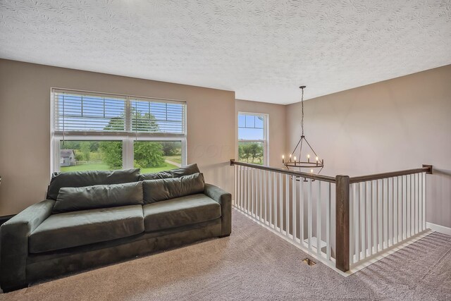 4483 County Road 124, Cardington, OH 43315 - living area with a chandelier, carpet, and a textured ceiling