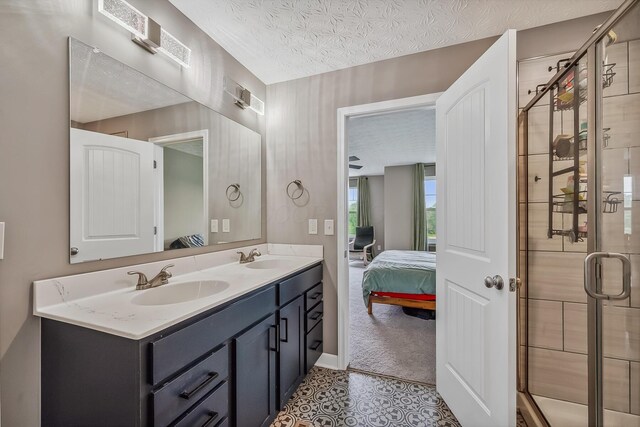 4483 County Road 124, Cardington, OH 43315 - bathroom featuring connected bathroom, double vanity, a stall shower, tile patterned floors, and a textured ceiling