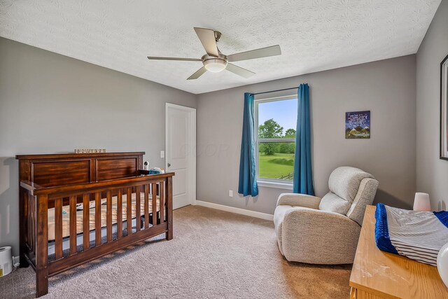 4483 County Road 124, Cardington, OH 43315 - carpeted bedroom featuring baseboards, a textured ceiling, and a ceiling fan