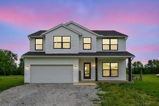 4483 County Road 124, Cardington, OH 43315 - view of front of home featuring covered porch, a garage, gravel driveway, and a front yard